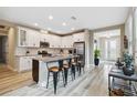 Spacious kitchen featuring an island, stainless steel appliances, and granite countertops at 16714 Savory Mist Cir, Bradenton, FL 34211