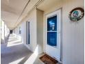Building exterior showing hallway and entrance to condo at 2110 Benjamin Franklin Dr # 105, Sarasota, FL 34236