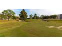 Landscaped golf course with mature trees and water features at 3640 Ironwood Cir # 601N, Bradenton, FL 34209