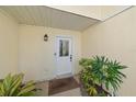 Front door entrance with a decorative glass window at 3941 Oakhurst Blvd # 3014, Sarasota, FL 34233