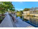 Scenic waterfront view from the dock, perfect for relaxing and enjoying the tranquility of canal living at 521 Cummings St, Sarasota, FL 34242