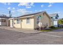Side view of charming yellow house with street parking at 6 Seminole Dr, Bradenton, FL 34208