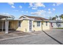 House's exterior showcases a classic design with a covered carport at 6 Seminole Dr, Bradenton, FL 34208