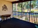 Screened balcony overlooking a lush green landscape at 1111 Faith W Cir # 2003, Bradenton, FL 34212