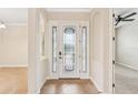 Interior entryway with tile flooring and stained glass door at 20345 Reale Cir, Venice, FL 34293