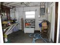 Large workshop area with workbench and storage shelves at 22342 Augusta Ave, Port Charlotte, FL 33952