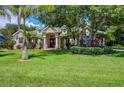 Stunning home with mature trees and a well-manicured lawn at 3706 162Nd E Ave, Parrish, FL 34219