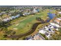 Aerial view showcasing community near golf course and waterway at 414 Cerromar S Cir # 249, Venice, FL 34293