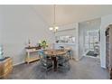 Bright dining area with four chairs and a view of the kitchen at 414 Cerromar S Cir # 249, Venice, FL 34293