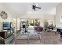 Bright living room featuring a sectional sofa and large windows at 4498 Diamond E Cir, Sarasota, FL 34233