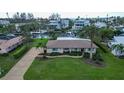 Bird's-eye view of single-story home with waterfront access at 5981 Emerald Harbor Dr, Longboat Key, FL 34228