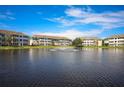Apartment buildings overlook a pond with a fountain at 4802 51St W St # 1406, Bradenton, FL 34210