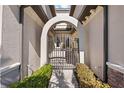Ornate arched gate leads to private courtyard entry at 5830 Wake Forest Run # 102, Bradenton, FL 34211