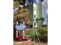 Condo building entrance with holiday decor at 5973 Terrace Park N Dr # 208, St Petersburg, FL 33709