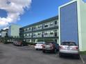 Multi-story condominium with balconies, secure entry, and ample parking at 5973 Terrace Park N Dr # 208, St Petersburg, FL 33709