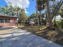 Side yard with boat and trailer, lush landscaping at 6227 33Rd St E, Bradenton, FL 34203