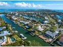 Waterfront home nestled in a tropical community with private boat dock at 671 Emerald Harbor Dr, Longboat Key, FL 34228