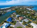 Bird's-eye view showcasing canal-front property and neighborhood at 671 Emerald Harbor Dr, Longboat Key, FL 34228
