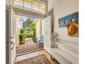 Bright and airy entryway with built-in bench seating and access to backyard at 6847 Bay Hill Dr, Lakewood Ranch, FL 34202