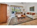 Spacious living room featuring comfortable seating and access to a patio at 6847 Bay Hill Dr, Lakewood Ranch, FL 34202