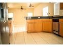 Functional kitchen with granite countertops, stainless steel dishwasher, and ample storage at 731 Cristelle Jean Dr, Ruskin, FL 33570