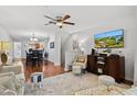 Open concept living and dining area with hardwood floors at 7325 Black Walnut Way, Lakewood Ranch, FL 34202
