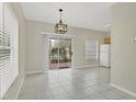 Bright dining area with tile floors and sliding glass doors to a patio at 7664 Plantation Cir, Bradenton, FL 34201