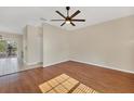 Spacious living room featuring hardwood floors and an open floor plan at 7664 Plantation Cir, Bradenton, FL 34201