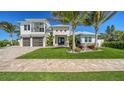 Two-story home with a two car garage and landscaping at 8013 20Th W Pl, Bradenton, FL 34209