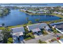 Aerial view of lakeside homes showcasing the desirable community layout and waterfront access at 9514 Colonial Dr, Bradenton, FL 34210