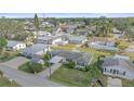 Aerial view showcasing a single-story house, driveway, and surrounding homes at 1521 Graber Ave, Sarasota, FL 34239
