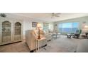 Bright living room with water views, comfy seating, and coastal decor at 4800 Gulf Of Mexico Dr # Ph 3, Longboat Key, FL 34228