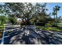 House nestled on a tree-lined street at 4802 Kestral Park Cir # 22, Sarasota, FL 34231