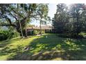 Landscaped yard with lush greenery at 4802 Kestral Park Cir # 22, Sarasota, FL 34231