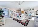 Bright and airy living room with comfortable seating and open floor plan at 4867 Sabal Lake Cir, Sarasota, FL 34238