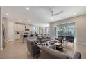 Open living room and kitchen with contemporary furniture and decor at 5433 Hope Sound Cir, Sarasota, FL 34238