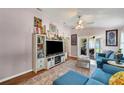 Living room with built-in entertainment center and comfortable seating at 585 Purdy St, Englewood, FL 34223