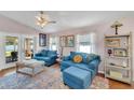 Relaxing sunroom with two comfy sofas and access to the backyard at 585 Purdy St, Englewood, FL 34223