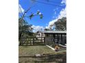 Home showcasing side yard and wooden fence at 6504 Lincoln Rd, Bradenton, FL 34203