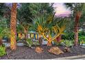 A beautiful home with exterior lighting and lush landscaping providing ample curb appeal at 730 40Th St, Sarasota, FL 34234