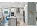 Modern kitchen with stainless steel appliances and island at 10732 Klee Ave, Bradenton, FL 34212