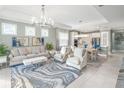 Spacious living room with light and airy feel and access to outdoor patio at 10732 Klee Ave, Bradenton, FL 34212