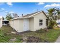 View of the exterior of a home showcasing a detached structure in the backyard at 3919 116Th Street W Ct, Bradenton, FL 34210