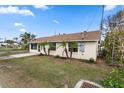 Side view of a charming single story home with well-maintained landscaping at 3919 116Th Street W Ct, Bradenton, FL 34210