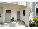 Condo entrance with a gray security door and tile flooring at 4330 Falmouth Dr # 108, Longboat Key, FL 34228