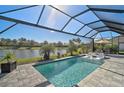 Relaxing screened-in pool with lake view at 5035 Kiva Cir, Bradenton, FL 34211