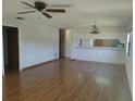 Living room with laminate floors and ceiling fan at 515 Leffingwell Ave # 109, Ellenton, FL 34222