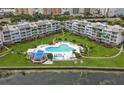 Aerial view of condo community pool with surrounding patio and green space at 5277 Isla Key S Blvd # 321, St Petersburg, FL 33715