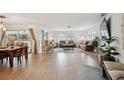 Spacious living area with comfortable seating and large TV at 530 Saint Andrews Dr, Sarasota, FL 34243