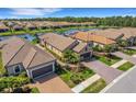 Community view with houses and a lake at 5341 Popoli Way, Sarasota, FL 34238